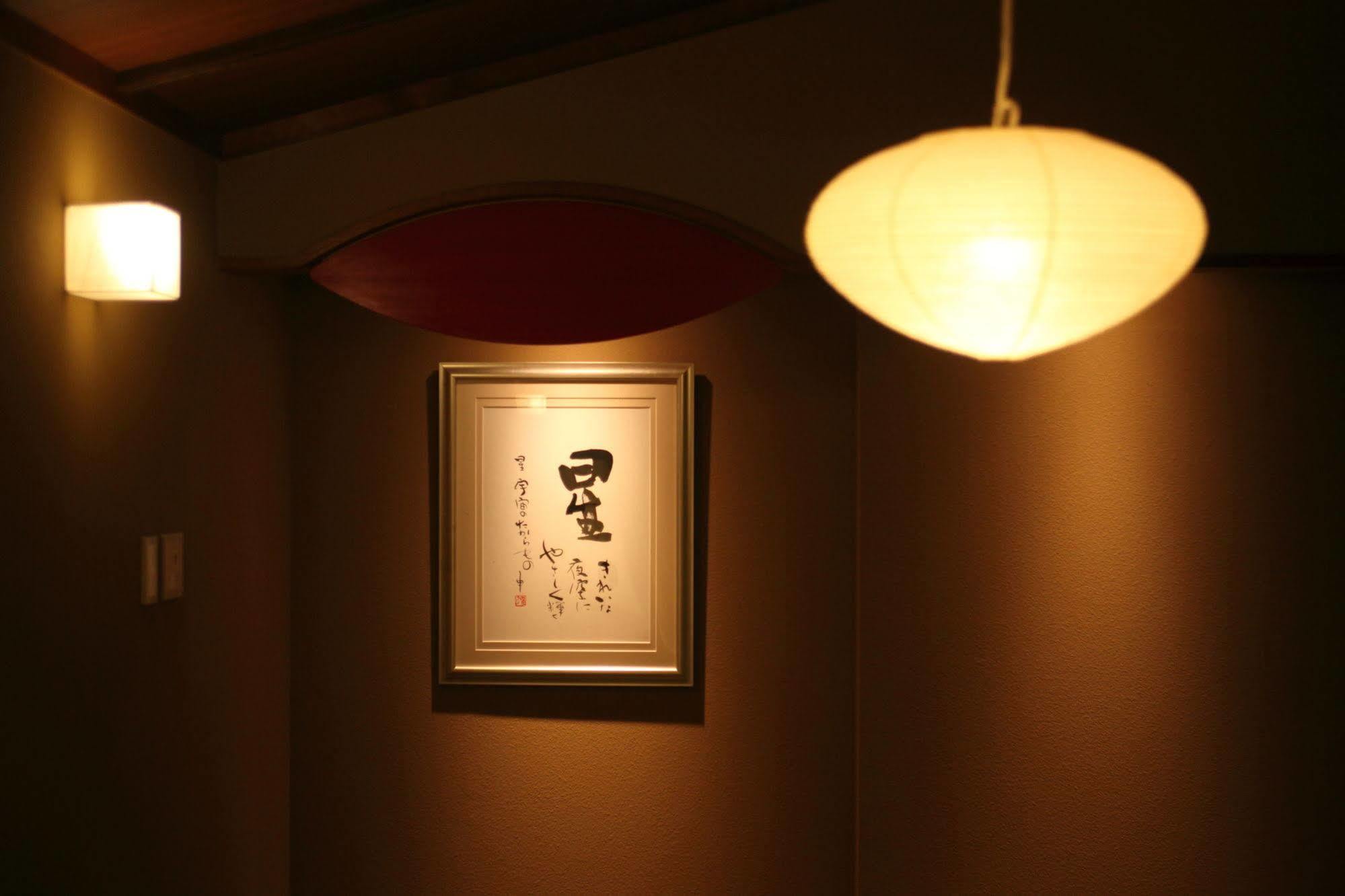 Amane Resort Seikai Бепу Екстериор снимка A Japanese room with a Japanese paper lamp